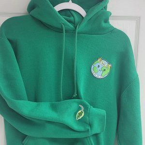 Adult small green hoodie with pocket and iron on patches